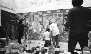 Collectif de peintres antifascistes painting a banner for a protest on May 1, 1976, directed against the government’s policies towards the arts. | Photo source: Claude Lazar